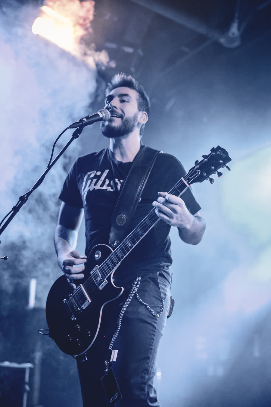 Guitarist in a beam of light